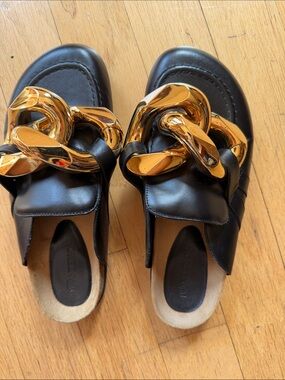 JW Anderson Black Leather Slip-On Mules with Gold Chain Accent